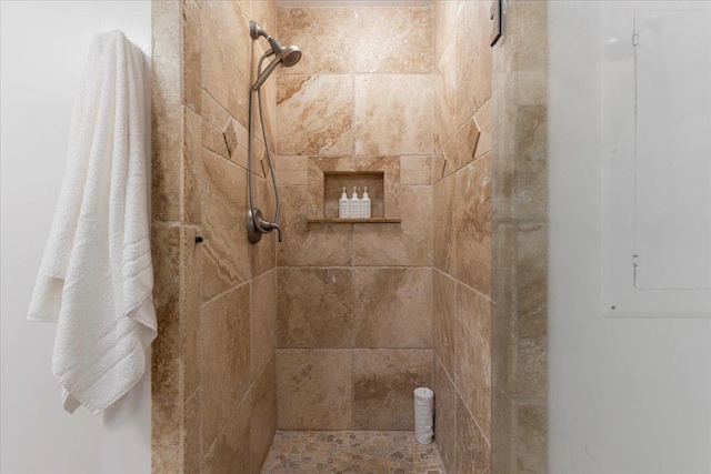 bathroom with tiled shower