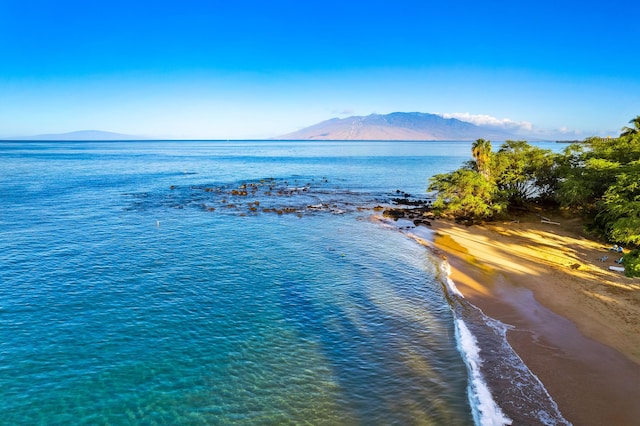 view of water feature with a view of the beach and a mountain view