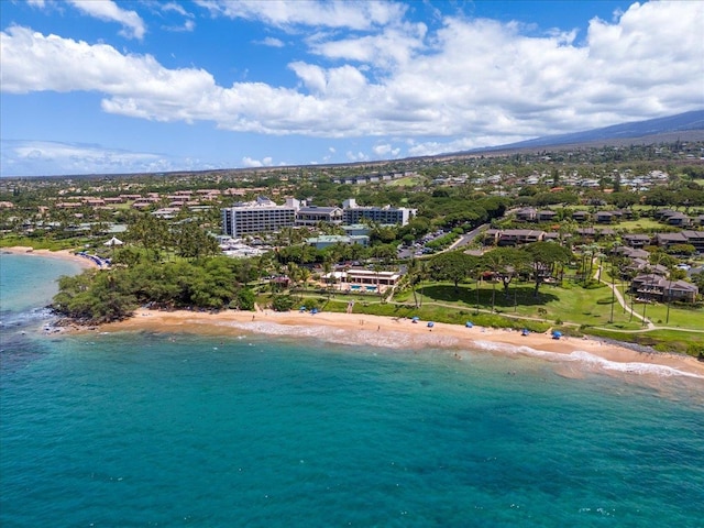 drone / aerial view featuring a view of the beach and a water view