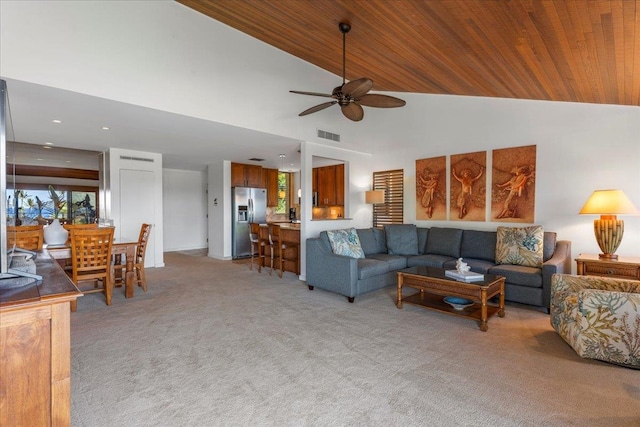 carpeted living room with ceiling fan, wood ceiling, and high vaulted ceiling