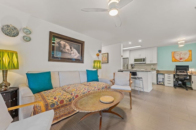 living room featuring ceiling fan