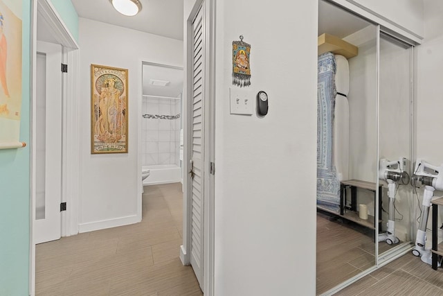 corridor featuring light wood-type flooring