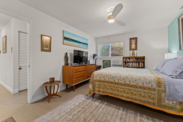 bedroom featuring ceiling fan and a closet