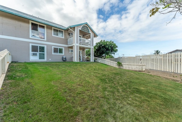 view of yard featuring a balcony