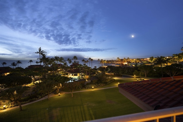 yard at dusk with a water view