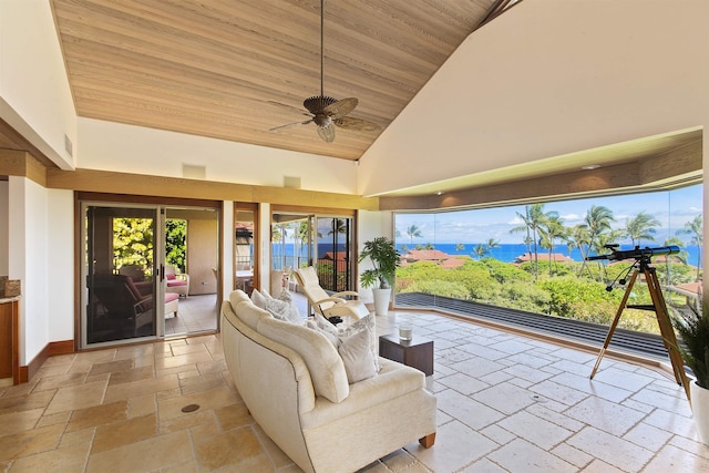 sunroom with ceiling fan, wooden ceiling, and vaulted ceiling