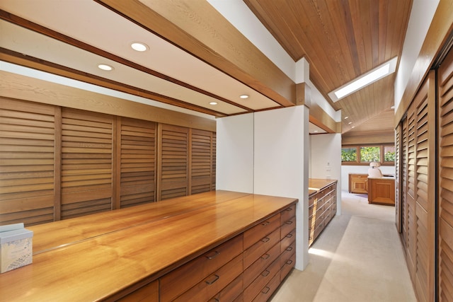 kitchen featuring light carpet, wooden ceiling, and lofted ceiling