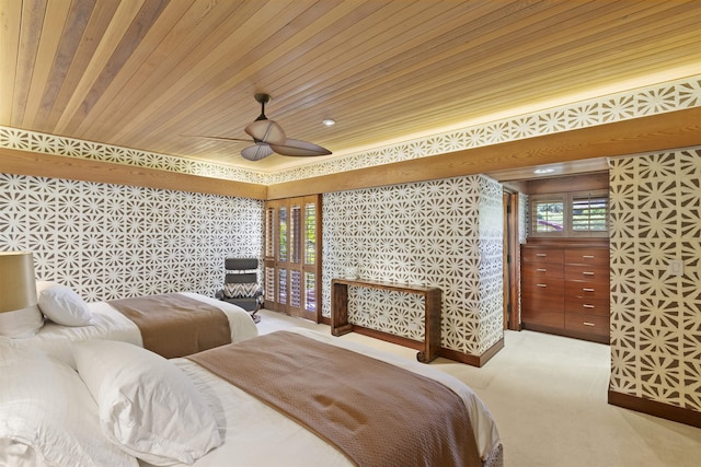 carpeted bedroom with ceiling fan and wood ceiling