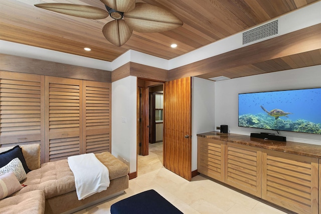 bedroom featuring light tile patterned flooring, a closet, wooden ceiling, and ceiling fan