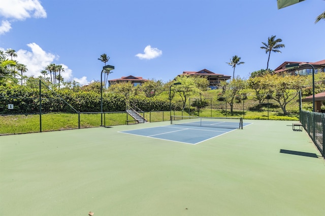 view of sport court featuring basketball hoop