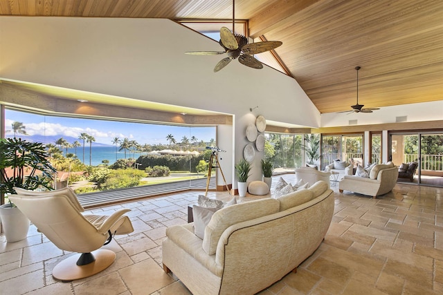 sunroom featuring vaulted ceiling, ceiling fan, and wood ceiling