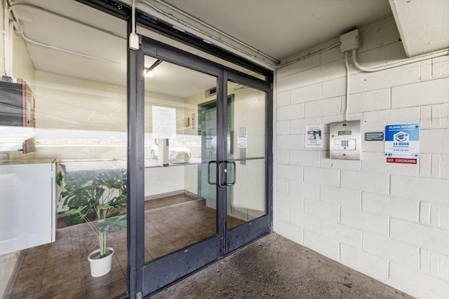 entrance to property featuring french doors