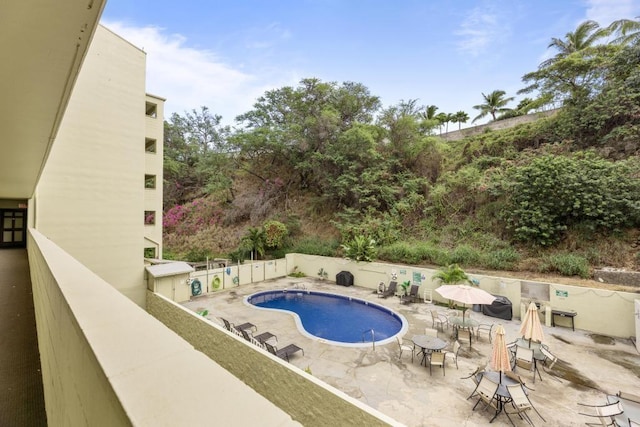 view of swimming pool with a patio area