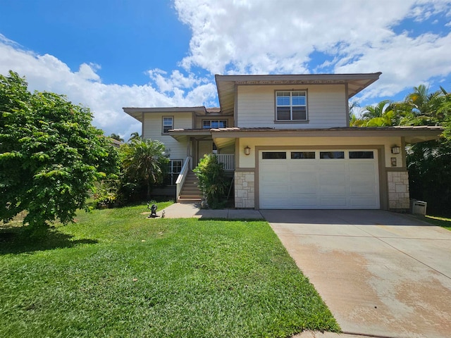 front of property featuring a garage and a front lawn