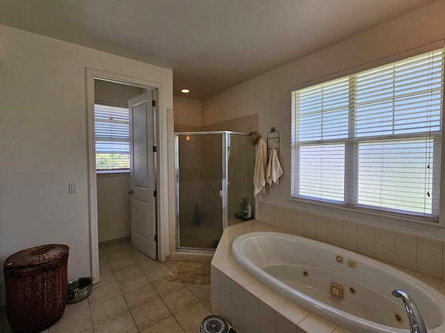 bathroom featuring separate shower and tub and tile patterned floors