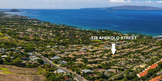 aerial view featuring a water and mountain view