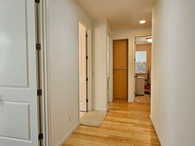 corridor featuring light hardwood / wood-style floors