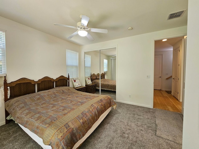 bedroom with carpet flooring, a closet, and ceiling fan