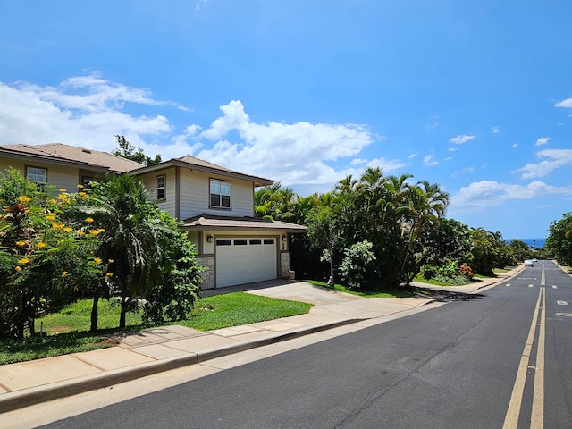 view of front of property with a garage