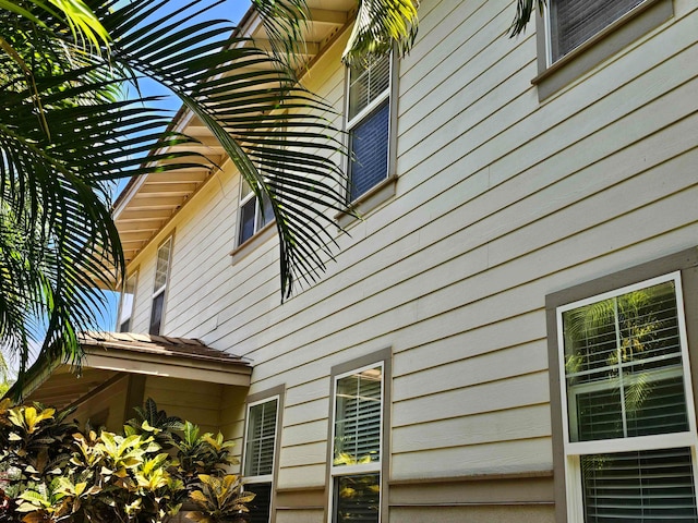 view of property exterior with a pergola