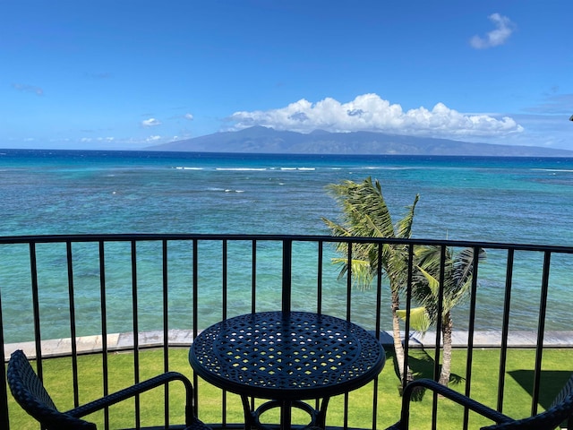 balcony with a water and mountain view