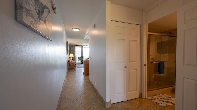 hall featuring light tile patterned floors