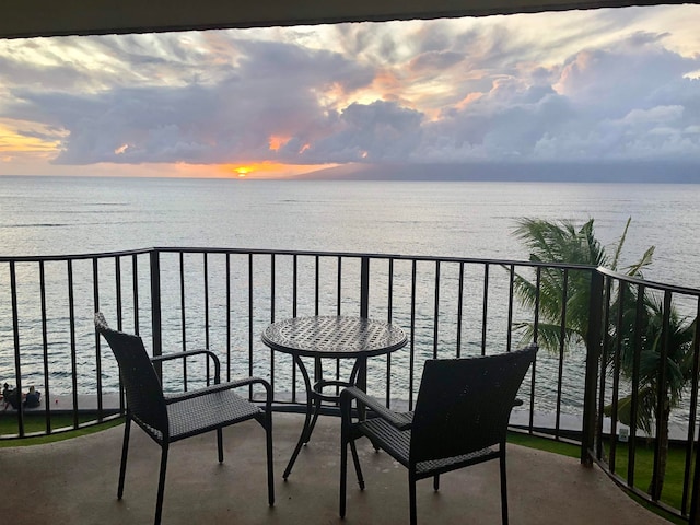 balcony at dusk with a water view