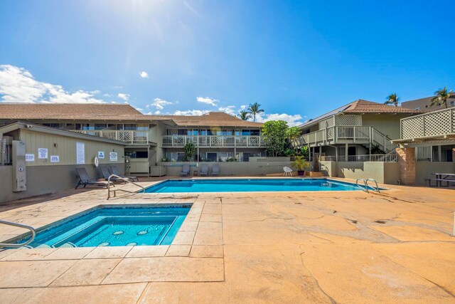 view of swimming pool with a patio