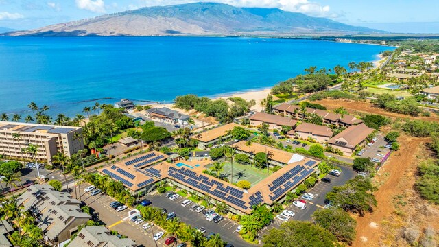 birds eye view of property featuring a water and mountain view