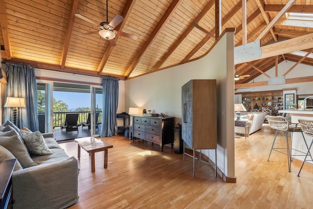 living room featuring beamed ceiling, light hardwood / wood-style flooring, wooden ceiling, high vaulted ceiling, and ceiling fan