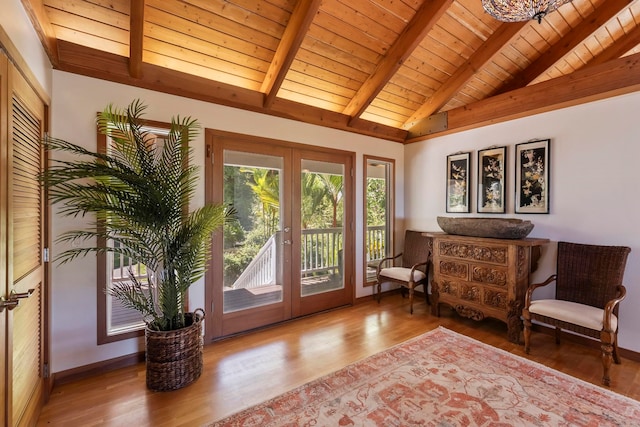 sitting room with french doors, wood ceiling, wood finished floors, and baseboards