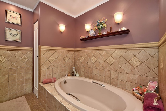 full bath featuring a wainscoted wall, a garden tub, and ornamental molding