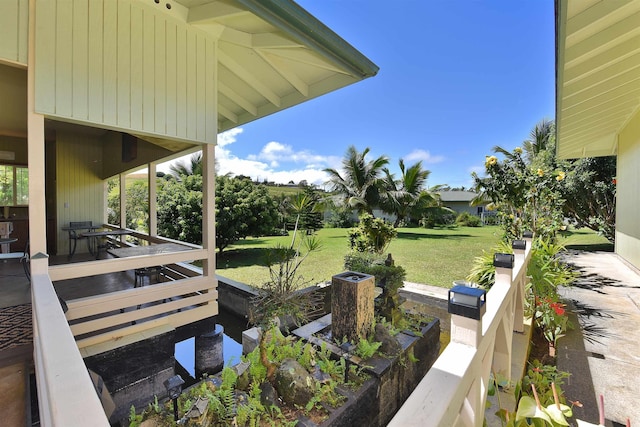 view of yard featuring covered porch