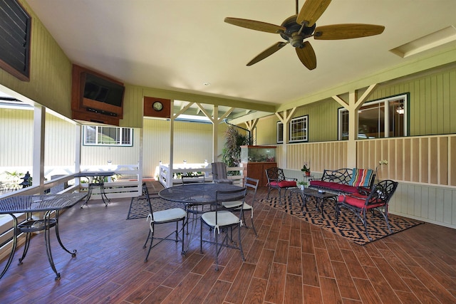 view of patio with outdoor dining space, outdoor lounge area, and a ceiling fan