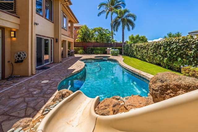 view of swimming pool with a patio area