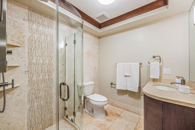 bathroom featuring vanity, tile patterned flooring, toilet, and walk in shower