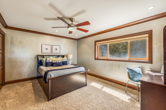 bedroom with ceiling fan, ornamental molding, and light colored carpet