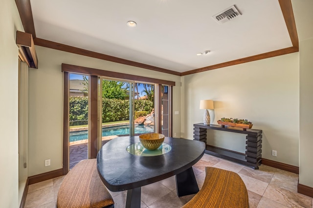 dining space featuring crown molding