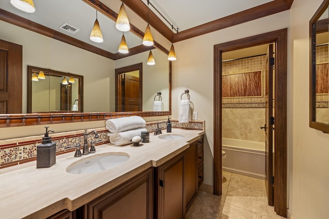 bathroom with vanity, tiled shower / bath combo, and tile patterned floors