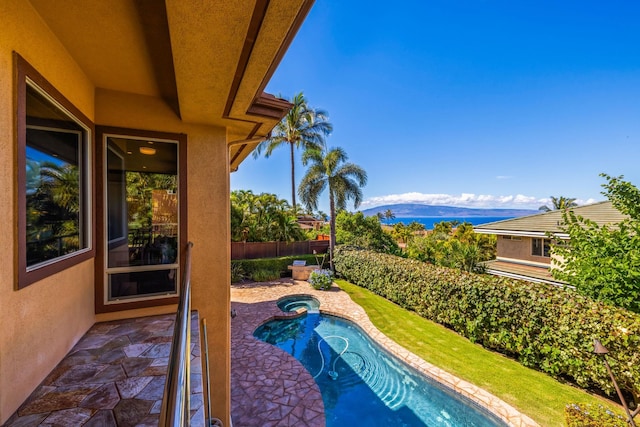 view of swimming pool featuring a mountain view and a patio area