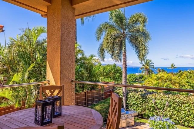 wooden deck with a water view