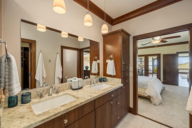 bathroom featuring vanity, tile patterned floors, ornamental molding, and ceiling fan