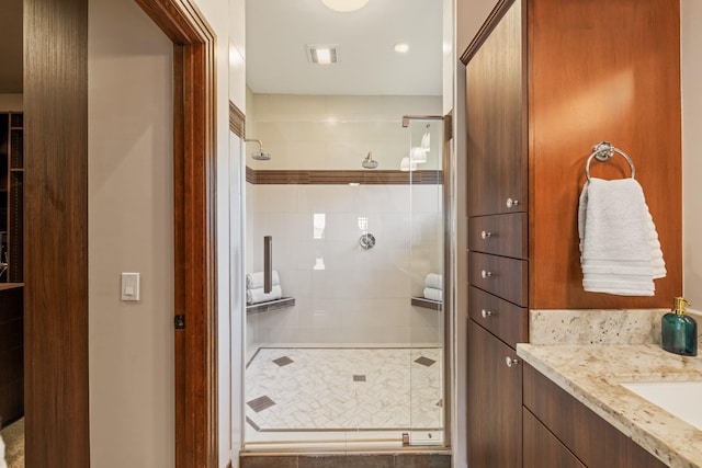 bathroom with vanity and walk in shower