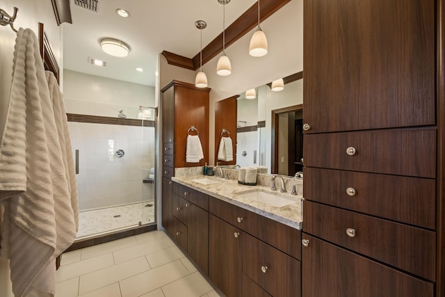 bathroom with vanity, tile patterned flooring, and walk in shower