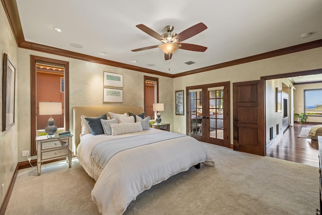 bedroom with ornamental molding, french doors, carpet floors, and ceiling fan