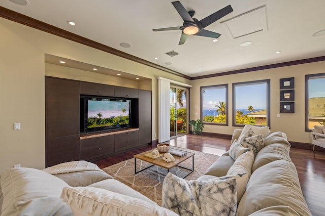 living room with crown molding, dark hardwood / wood-style floors, and ceiling fan