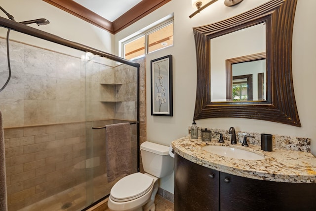 bathroom featuring toilet, an enclosed shower, ornamental molding, and vanity