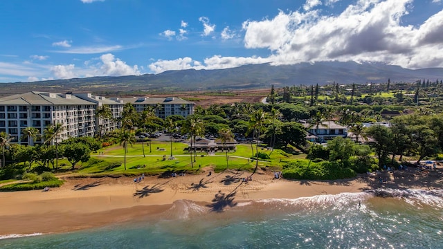 aerial view featuring a water and mountain view and a view of the beach