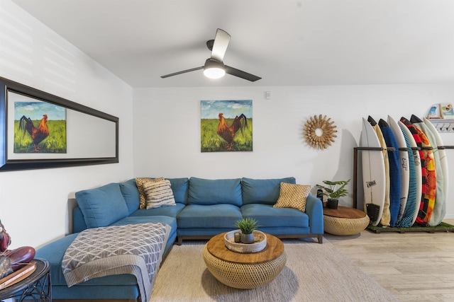 living room with ceiling fan and wood finished floors