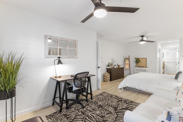 bedroom featuring light wood-style floors, ceiling fan, and baseboards